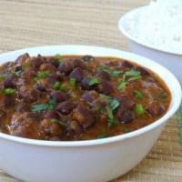 Kala Channa Curry · Black chick peas slowly cooked with tomatoes, onions and spices.