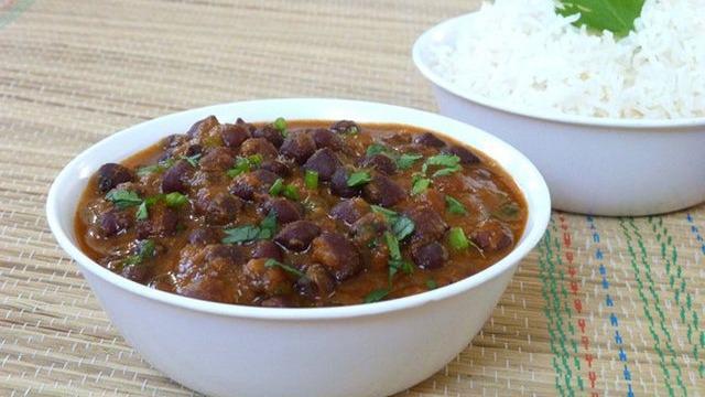 Kala Channa Curry · Black chick peas slowly cooked with tomatoes, onions and spices.