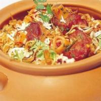 Goat Biryani · Long grain basmati rice delicately cooked with goat, yogurt, and special spices.