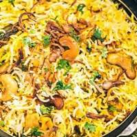 Vegetable Dum Biryani · Long grain basmati rice delicately cooked on dum fresh vegetables, yogurt and special spices.