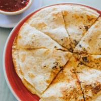 Chicken Quesadilla · Cooked tortilla that is filled with cheese and folded in half.