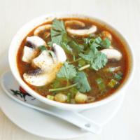 Tom Yum Soup · Spicy. The spicy classic soup serves with chicken or shrimp in chicken broth topped with cho...