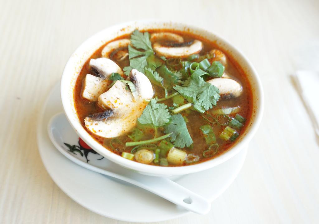 Tom Yum Soup · Spicy. The spicy classic soup serves with chicken or shrimp in chicken broth topped with chopped scallions and cilantro.