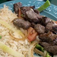 Shish Kabab · Marinated slices of beef mixed with green peppers, onions, and tomatoes charbroiled. Served ...