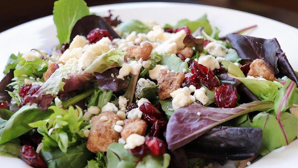 Cranberry Walnut Salad · Mixed Greens, Dried Cranberries, Candied Walnuts, Blue Cheese Crumbles and Balsamic Vinaigrette