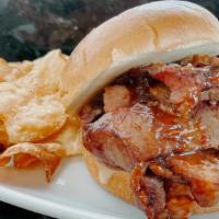 Bbq Brisket Sandwich · Smoked Brisket, House made BBQ Sauce and Cheddar Cheese