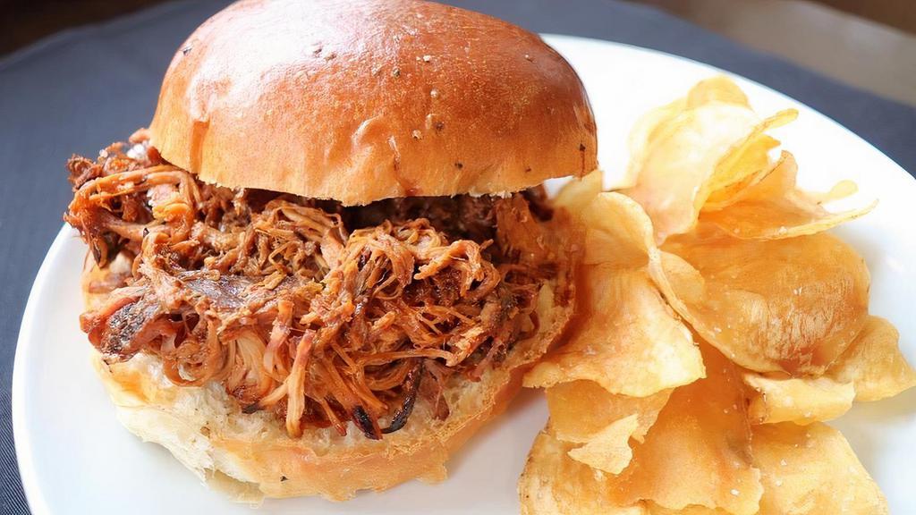 Pulled Pork Sandwich · House Smoked Pulled Pork, Homemade Bourbon BBQ Sauce and Pickles