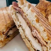 Chicken Cordon Bleu Panini · Hand Breaded Chicken Cutlet topped with Ham, Swiss cheese and Dijon Mustard