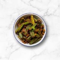 Okra Classic · Tender okra pods sauteed in a curry base made with piquant onions, tangy tomatoes, bold spic...