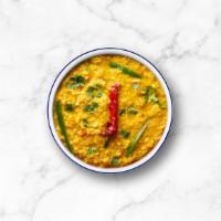 Licious Lentil · Slow-cooked yellow lentils, tempered with flash-fried whole spices, garnished with fresh cil...