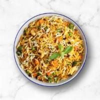 Veggie Biryani · Long grain aromatic basmati rice simmered in Indian spices with seasonal vegetables, fresh h...