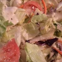 Greek Salad · Tomatoes, cucumbers, onions, olives, and feta cheese in an olive oil dressing.