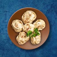 Bold Beef Dumpling · These dumplings are dunked in our delicious gravy sauce with a curry like consistency. Once ...