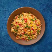 Signature Rice · Long grain imported premium rice is stirred in a wok with a selection of fresh vegetables to...