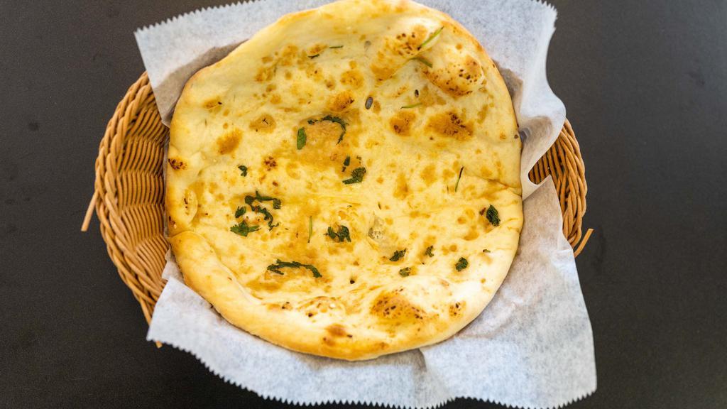 Garlic Naan · Top menu item. Bread topped with freshly chopped garlic.