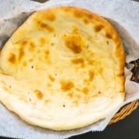 Naan · Top menu item. Leavened white flour baked in a clay oven, served hot.
