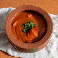 Chicken Curry · Boneless chicken in a tomato and onion spiced sauce. Served with rice.
