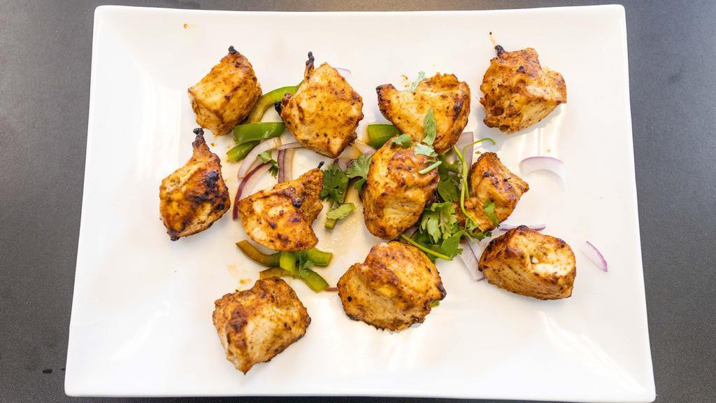 Garlic & Ginger Kebab · Succulent cubes of chicken, marinated in yogurt, garlic and ginger then roasted in clay oven.