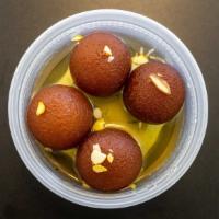 Ghulab Jamun · Cottage cheese balls fried and cooked in honey syrup. Served hot.