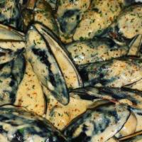 Garlic Parmesan Mussels · Our famous mussels, freshly prepared in our signature creamy garlic parmesan sauce and serve...