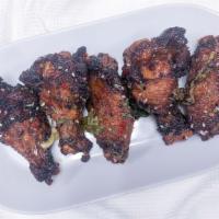 Honey Buffalo Wings · Six succulently seasoned wings, deep fried and smothered in our homemade honey buffalo sauce...