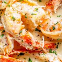 Shrimp Scampi Appetizer · Six large shrimp cooked in our signature garlic parmesan sauce, and served with a toasted fr...