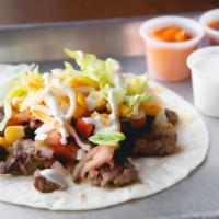 Taco · Corn or flour tortilla, with your choice of protein and toppings.