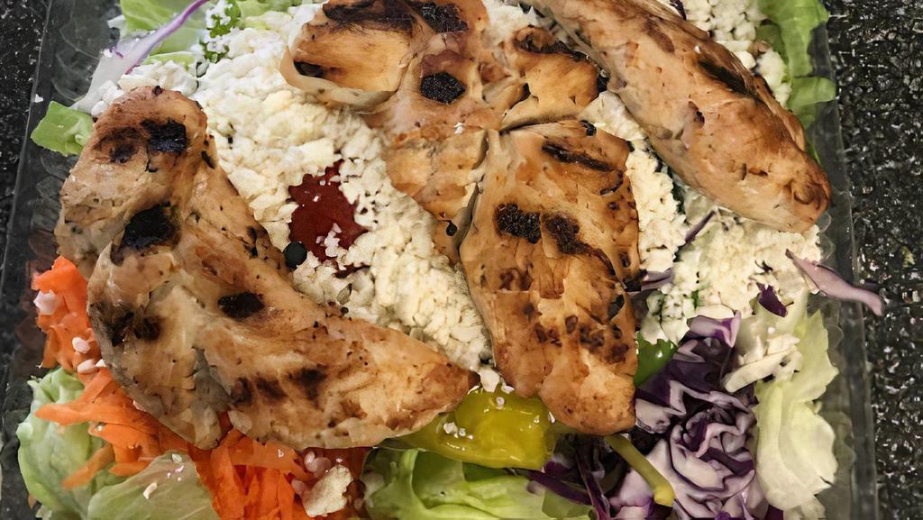Grilled Chicken Caesar Salad · Add extra feta, dressing, or pita for an additional charge.