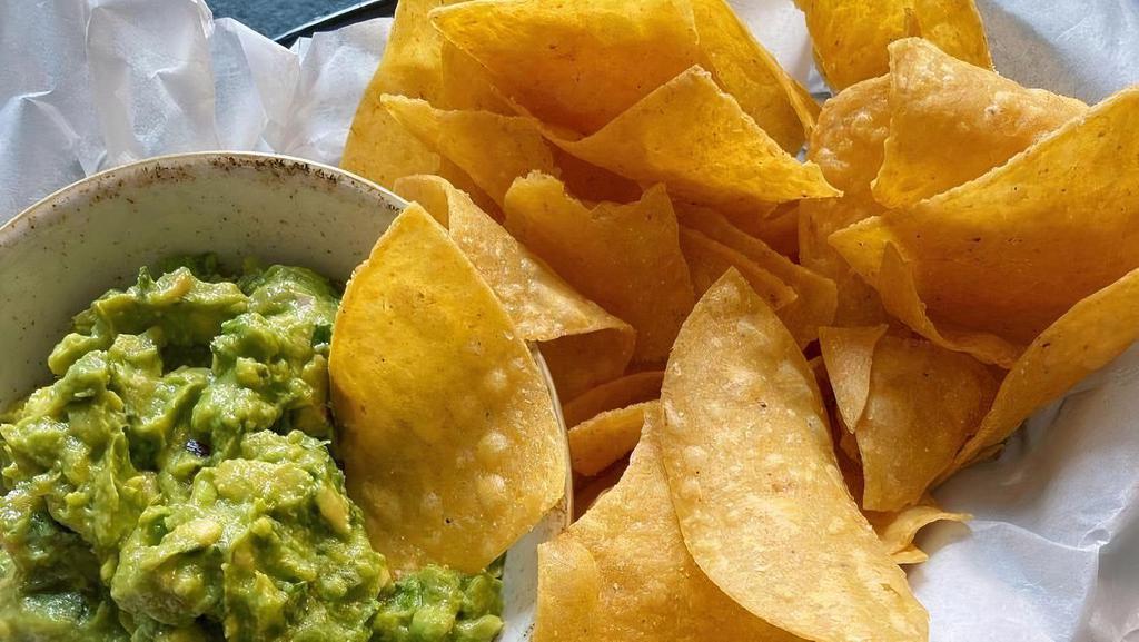 House-Made Chips & Guacamole · house-made corn tortilla chips with fresh guacamole. gluten free + vegan.