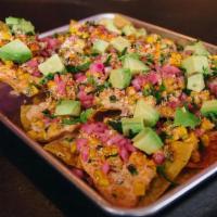 Street Corn Nachos · tortillas, elote, cheddar & cotija cheese, pickled red onions, poblano peppers, fresh avocad...