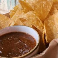 House-Made Chips & Salsa · house-made corn tortilla chips with roasted salsa rojo. gluten free + vegan.