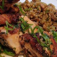 Roasted Chicken Breast · Chicken Andouille Dirty Rice, Charred Caulilini, Brown Butter Caper Jus