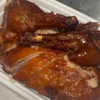 S17 Crispy Duck · Bone in half crispy roasted duck with side of hoisin dipping sauce