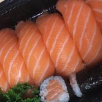 Salmon Lover · Eight pieces of salmon sushi and  a salmon roll.