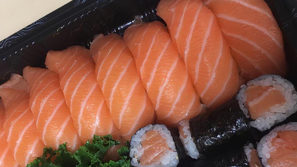 Salmon Lover · Eight pieces of salmon sushi and  a salmon roll.