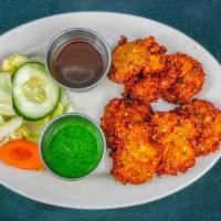 Mixed Veg Pakora · Vegan. Onions, potatoes, cabbage, mixed with chickpea flour, herbs and spices, and deep frie...