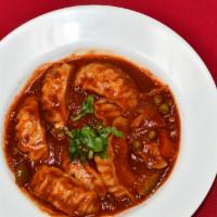 Chili Mo Mo · Gluten. Dumplings served in the chef's special chili sauce with red onions, and three types ...