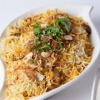 Biryani · Saffron flavored basmati rice, mildly spiced with traditional herbs, dressed with fried onio...
