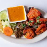 Tandoori Mix Grill · Chicken, shrimp, lamb marinated with herbs and spices, and baked in tandoor.