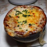 French Onion Soup Gratinée · Beef-Mushroom Broth, Emmental Cheese.