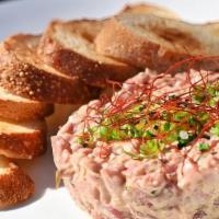 Tuna Confit Sandwich · Charred-Onion Jam, Artichokes, Sun-Dried Tomatoes, Aoili, Baguette, Frites.