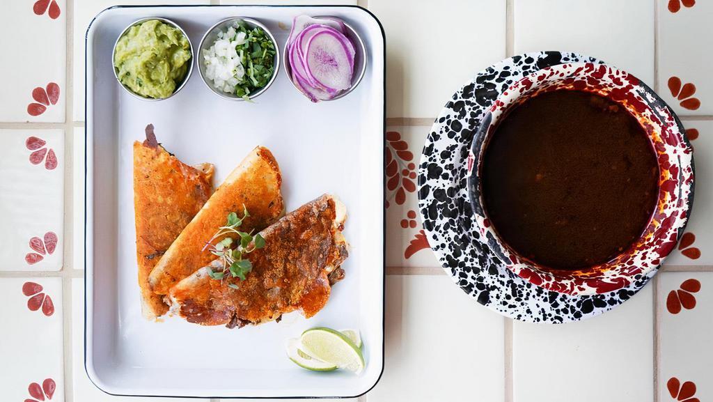Quesa Birria · Grass-fed, sustainable beef consommé w/ 3 mini quesadillas stuffed w/braised short ribs and  served with guacamole, onion , radishes and cilantro (GF)
