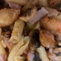 Chicken Marsala · Chicken cutlet sauté mushrooms and ham in Marsala wine sauce served over pasta.