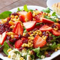 Strawberry, Cranberry, And Walnut Salad · Dried cranberries, toasted walnuts, Feta cheese, strawberries, and mixed greens served with ...