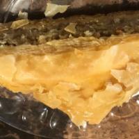 Baklava · A rich, sweet dessert pastry made of layers of filo filled with chopped nuts & covered in ho...