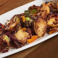 Crispy Brussels Sprouts · Cinnamon chipotle spiced, apricots, cranberries, pecans, ranch.