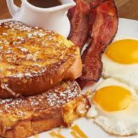 Caramel French Toast + Eggs · Cinnamon powdered sugar, strawberries, salted caramel drizzle, eggs, choice of meat.
