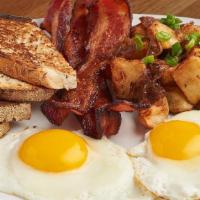 Barnyard Breakfast · Eggs, choice of meat, home fries with cholula onions, toast.