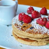 Oat Milk 2 Berry Pancakes · Stack of oat milk pancakes, blueberries, topped. with raspberries, sunflower seeds, thyme,. ...