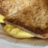 Breakfast Sandwich · Scrambled eggs with cheese. Optional add avocado mix. *contains dairy.